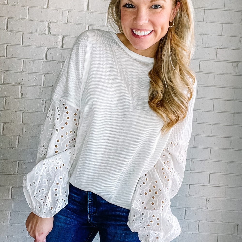 White waffle-knit long sleeve top with eyelet sleeves